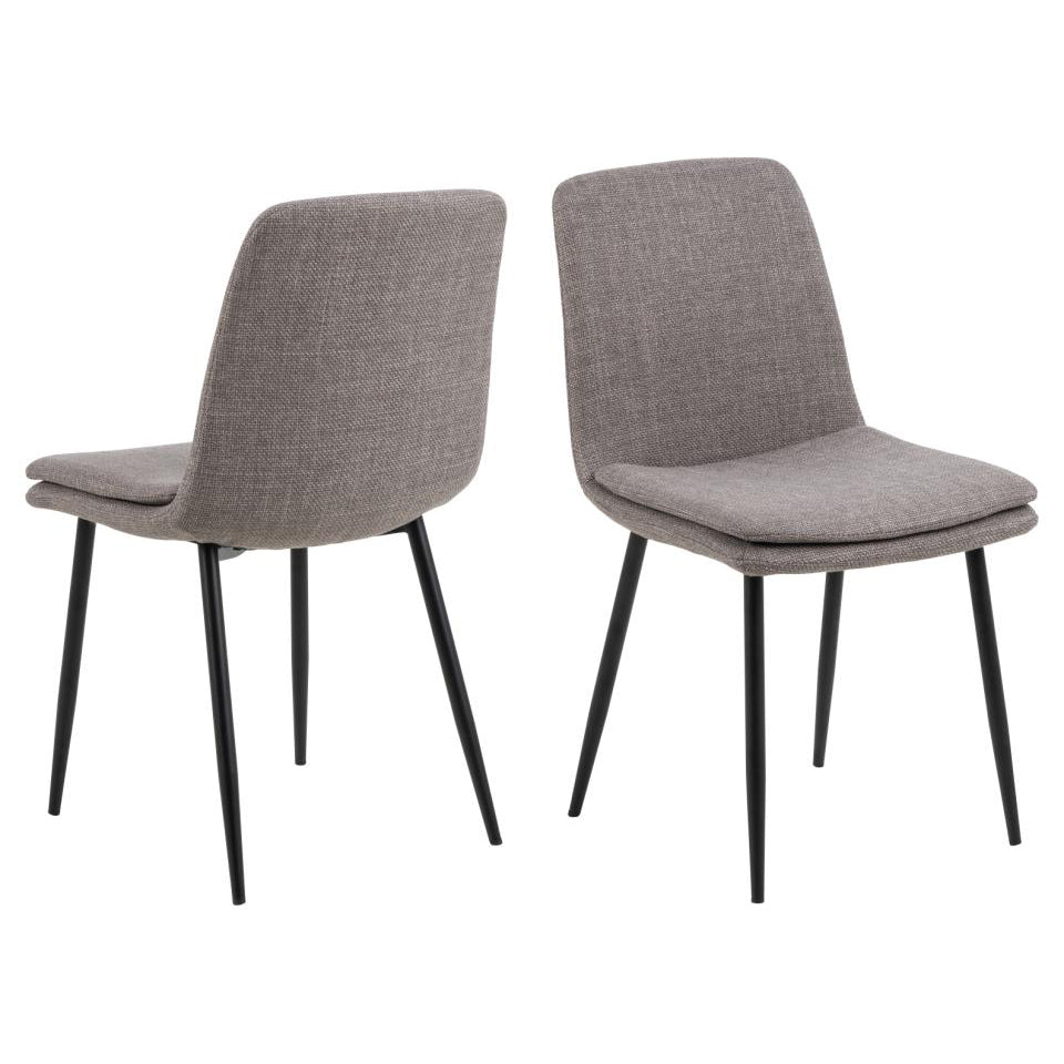 A set of two fabric dining chairs with matte black metal legs and upholstered in a light grey-brown fabric.