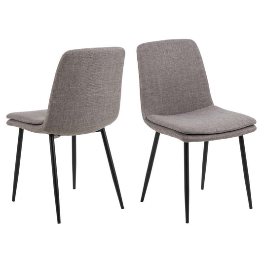 A set of two fabric dining chairs with matte black metal legs and upholstered in a light grey-brown fabric.