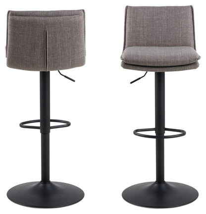 A pair of Flynn grey fabric bar stools with footrests and round bases on a white background