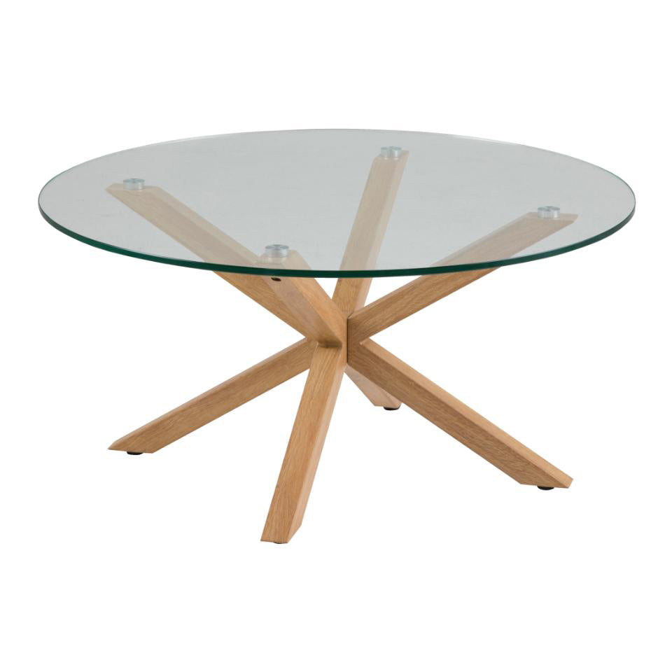 A large round glass coffee table with a metal base that has an oak foil finish. The table is clear with a visible oak-colored cross-legged design.