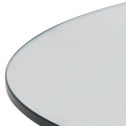 close up of the round clear glass table top of a heaven coffee table on a white background