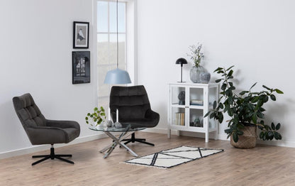 heaven clear glass coffee table in a modern home with 2 chairs, a plant and white bookcase unit