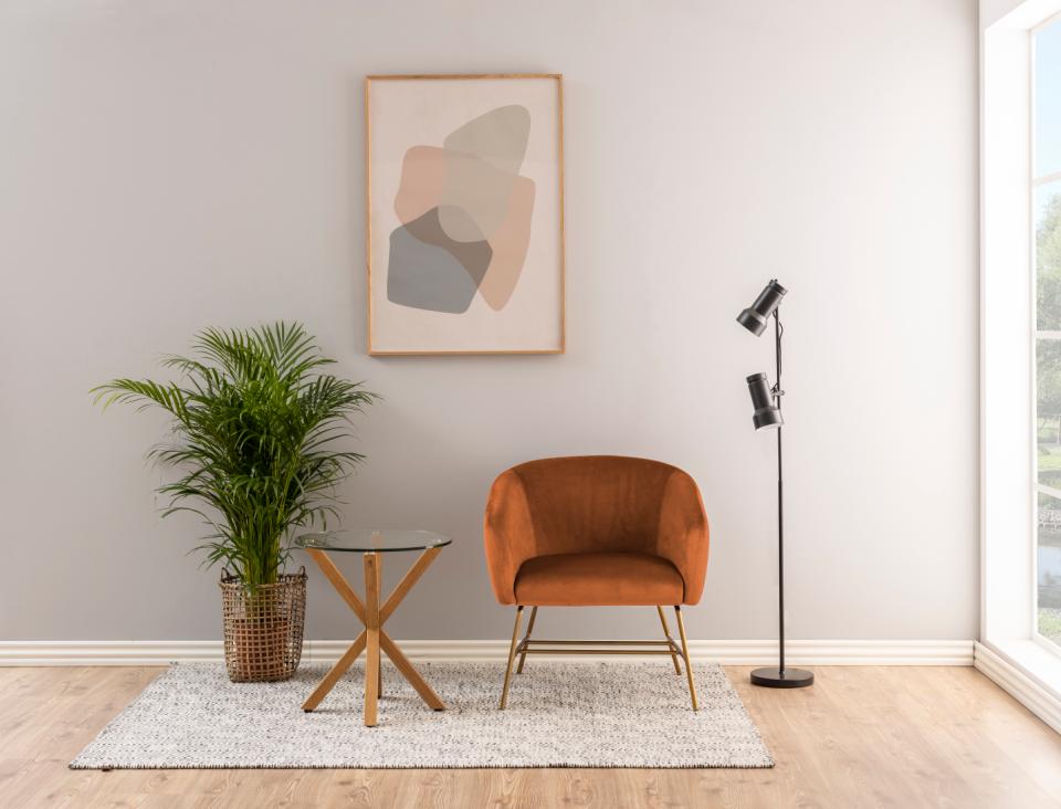 a heaven lamp table in a roomset with a brwn chair and plant