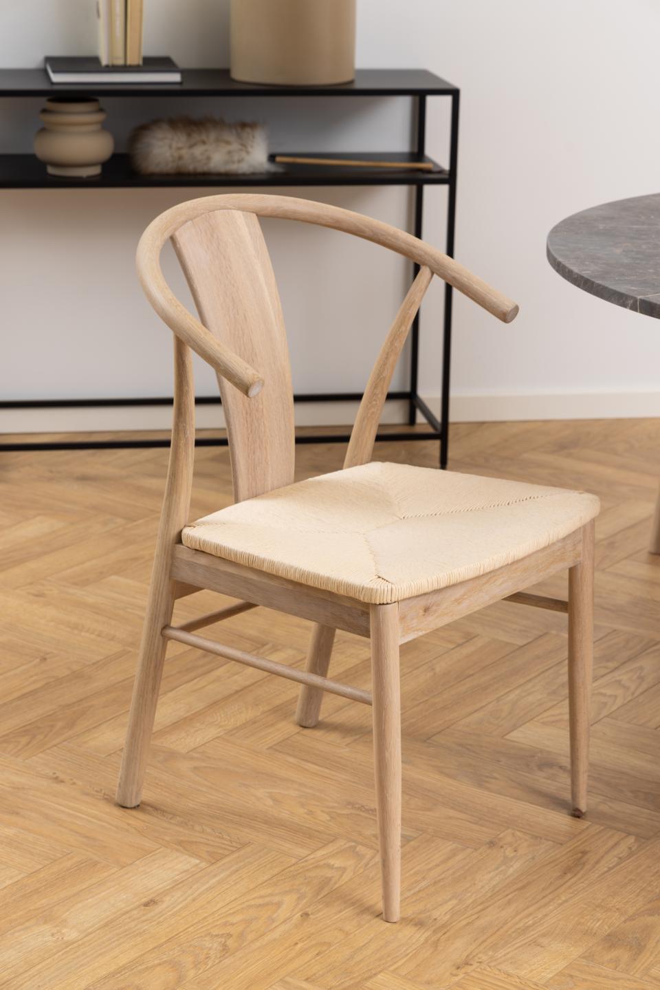 a single designer rope plaited janik dining chair in a modern home