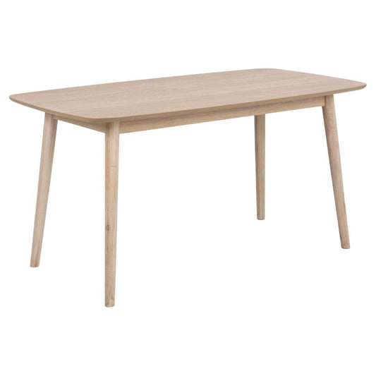 A white rectangular dining table with rounded edges and a visible wooden grain, having a light oiled oak finish.