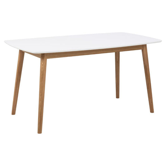 A white rectangular dining table with rounded edges and a natural oak wood base, designed to seat 4 to 6 people.